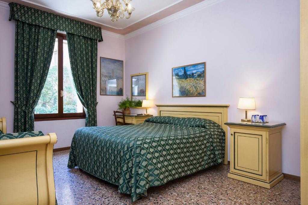 Postel nebo postele na pokoji v ubytování Zaguri B&B
