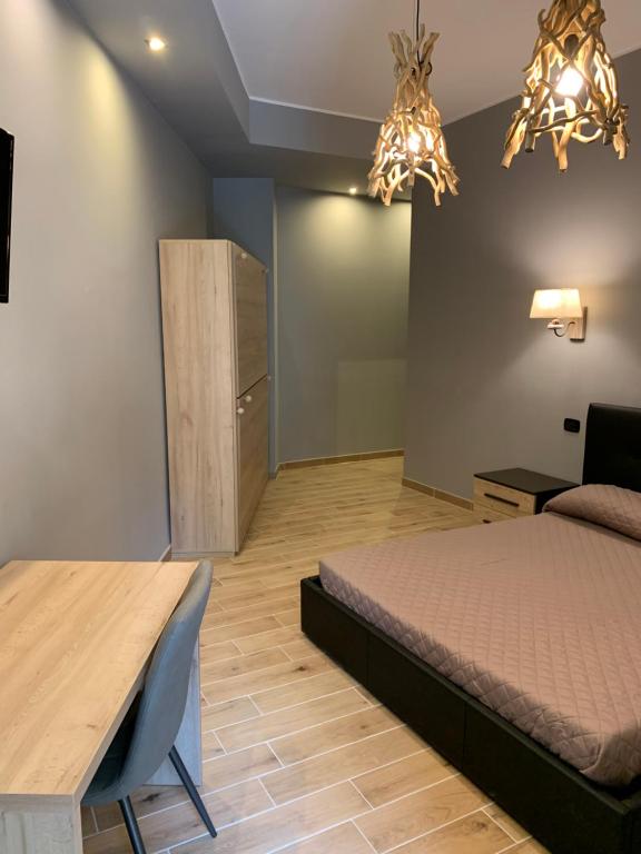 Postel nebo postele na pokoji v ubytování MARCONI 2 rooms