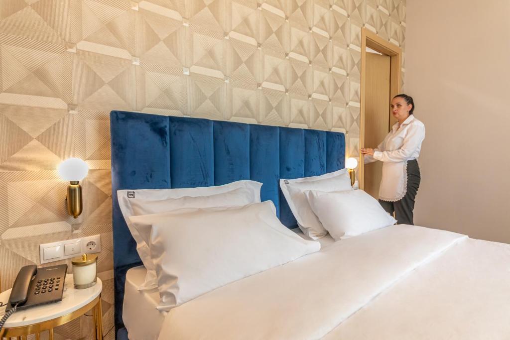 Postel nebo postele na pokoji v ubytování Newport Hotel Kutaisi