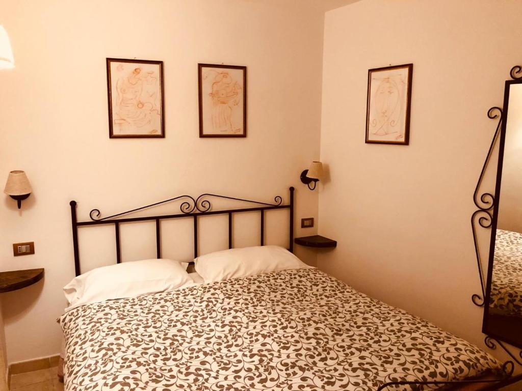 Postel nebo postele na pokoji v ubytování Le Antiche Porte