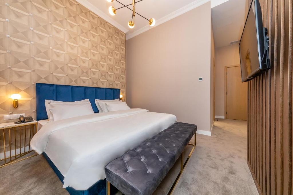 Postel nebo postele na pokoji v ubytování Newport Hotel Kutaisi