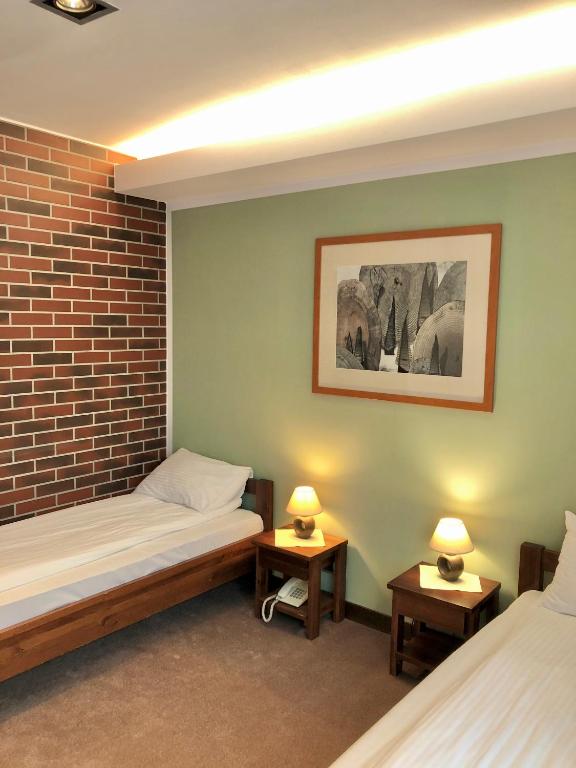 Кровать или кровати в номере Hotel Olecki