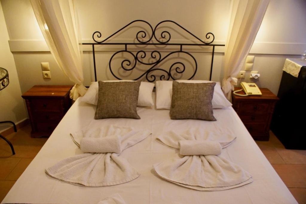Postel nebo postele na pokoji v ubytování Hotel Notara