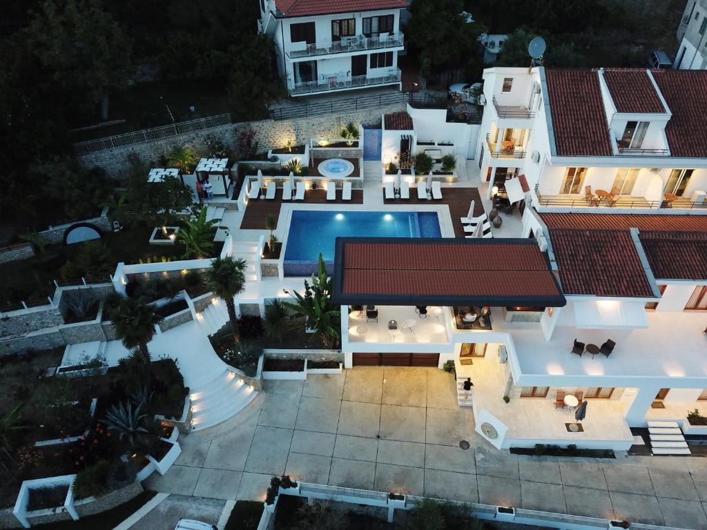 an aerial view of a mansion with a swimming pool at Apartments Secret Garden in Ulcinj
