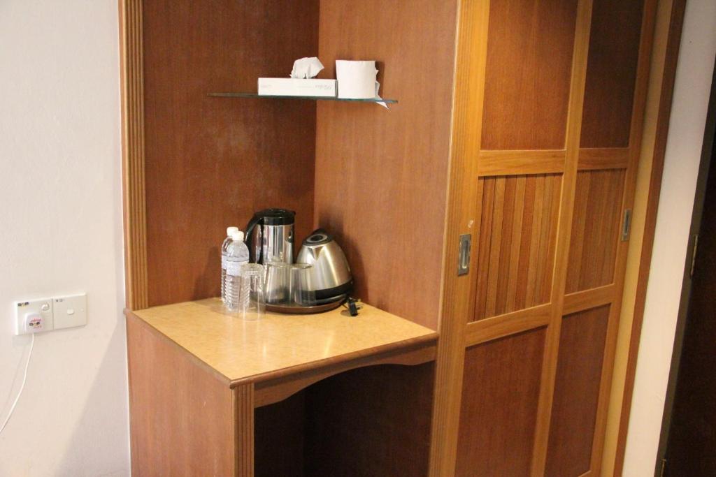 Příslušenství pro přípravu čaje a kávy v ubytování Miri Hotel