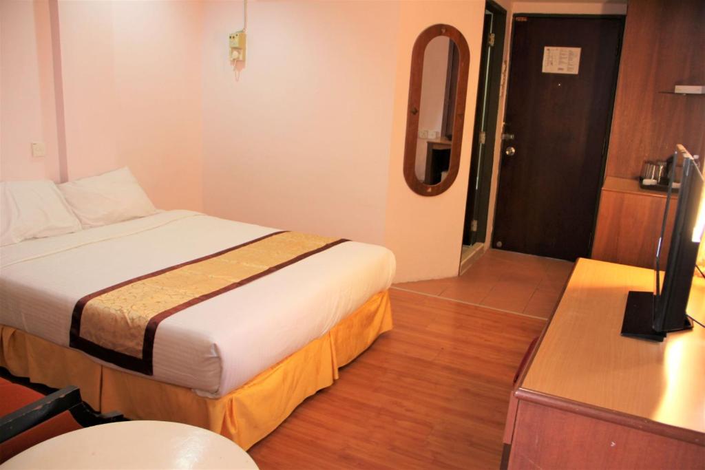 Postel nebo postele na pokoji v ubytování Miri Hotel
