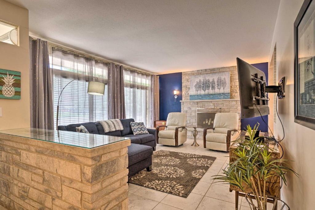 a living room with a couch and a table at Pet-Friendly CO Springs Home with Koi Pond and Patio in Colorado Springs