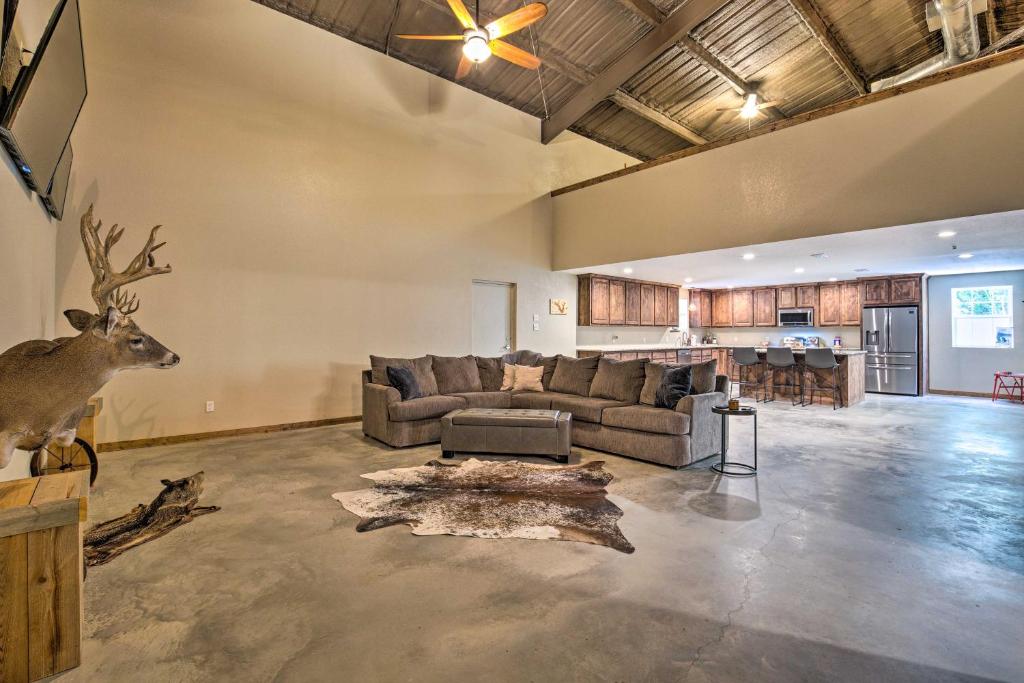 a large living room with a couch and a deer in it at Secluded Home with Gas Grill, 3 Mi to Boating! in Yantis