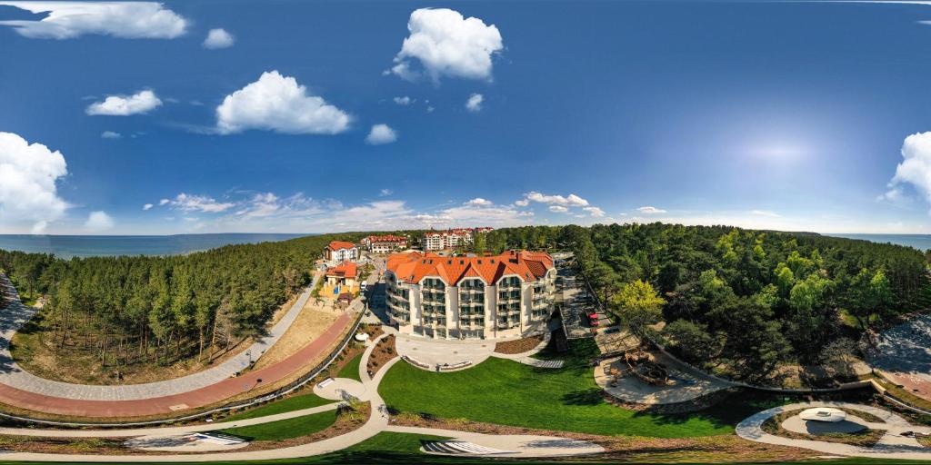 an aerial view of a large building on a hill at White Resort in Krynica Morska