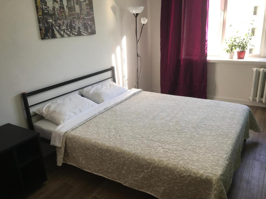 A bed or beds in a room at Apartment Koltsovo Park