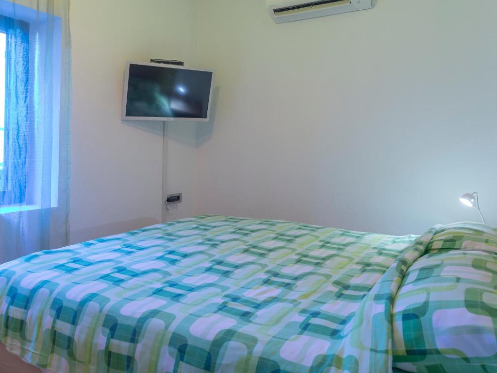 Postel nebo postele na pokoji v ubytování Apartments Windrose