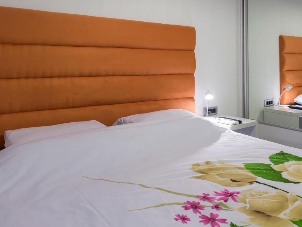 Postel nebo postele na pokoji v ubytování Apartments Windrose