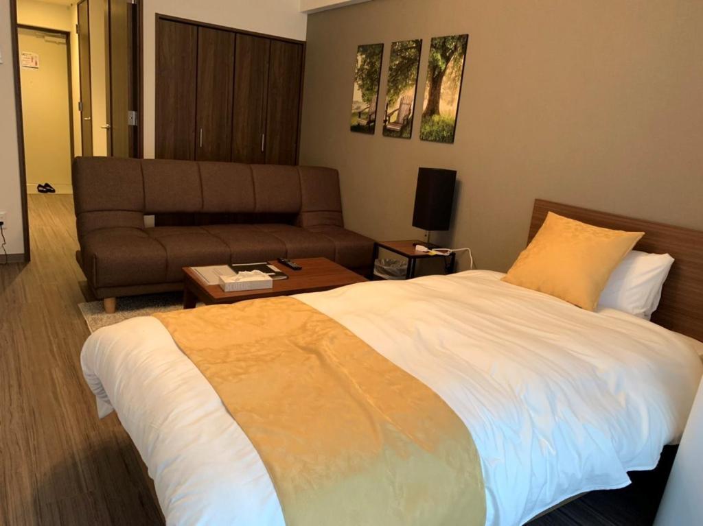 Cama ou camas em um quarto em @RLiS_house Tsutenkaku - Vacation STAY 7958