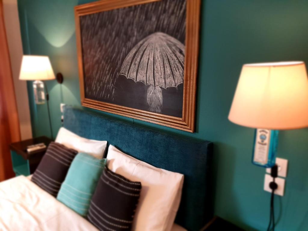 Postel nebo postele na pokoji v ubytování Aigaion Guesthouse