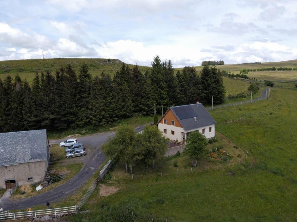 an aerial view of a farm with a house and a road at Horizon Aubrac Laguiole in Laguiole