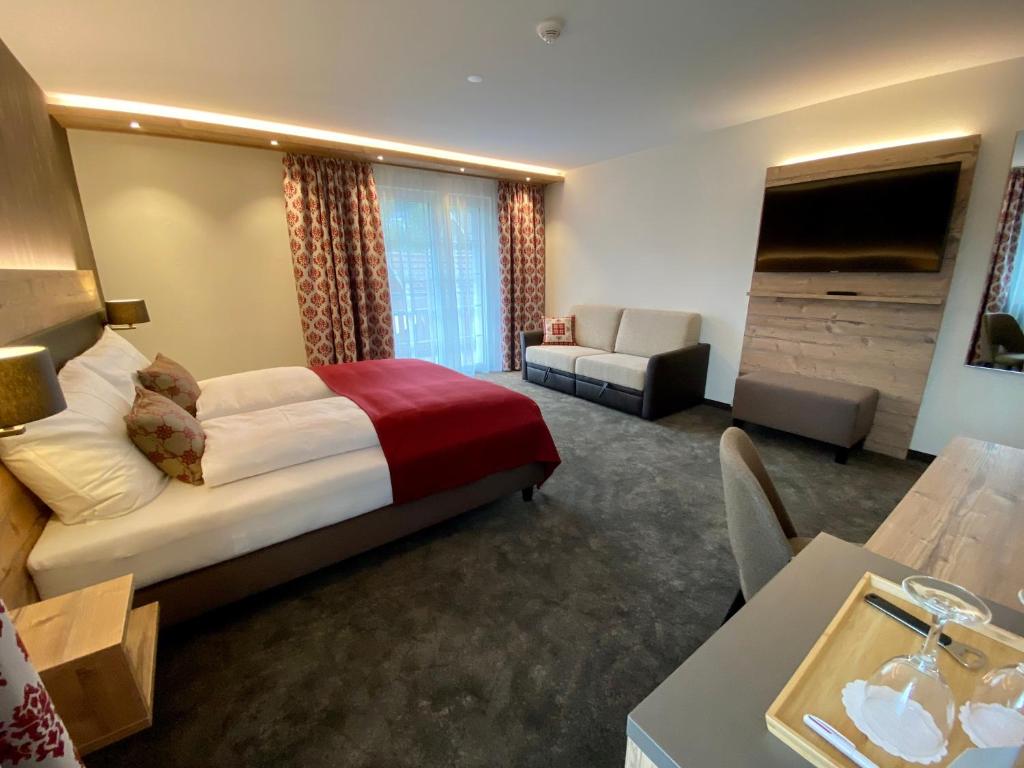 Postel nebo postele na pokoji v ubytování Hotel Gibswilerstube
