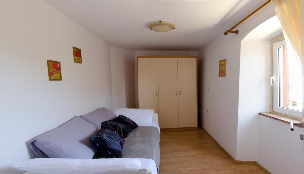 Postel nebo postele na pokoji v ubytování Apartments Percic