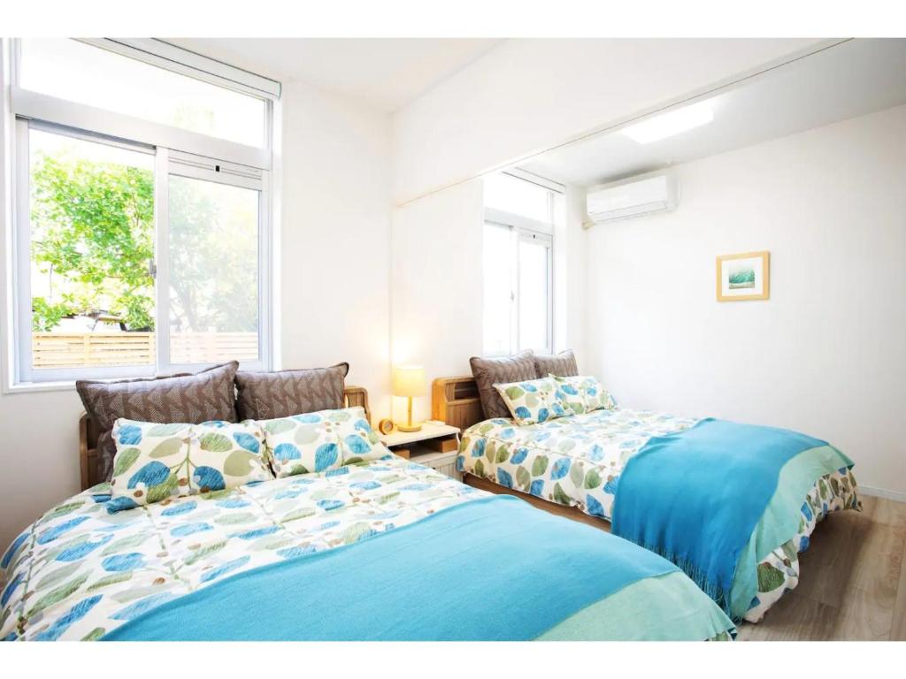 Katil atau katil-katil dalam bilik di Invest House - Vacation STAY 83683