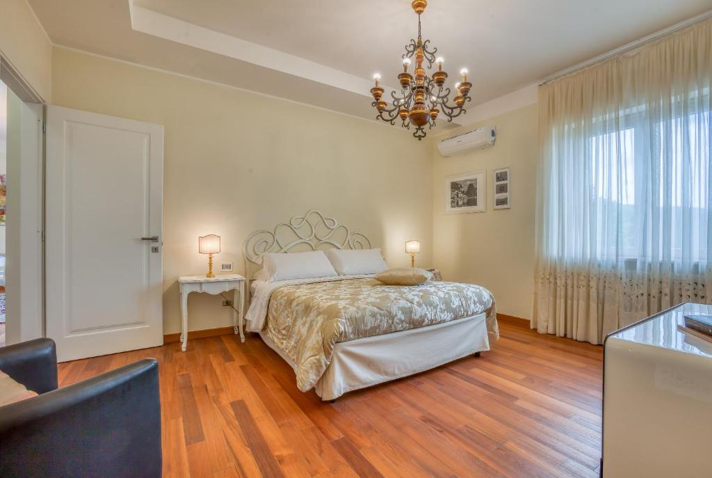 Postel nebo postele na pokoji v ubytování Hotel Villa De Santis