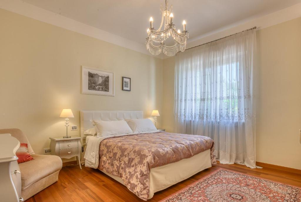 Postel nebo postele na pokoji v ubytování Hotel Villa De Santis