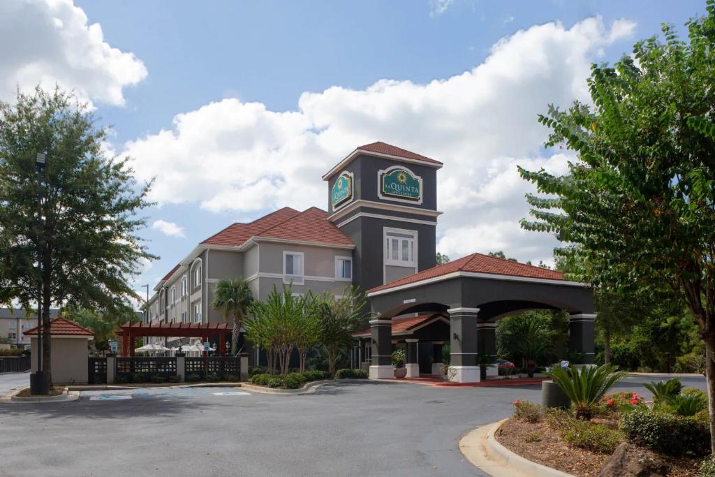a building with a clock tower on top of it at La Quinta by Wyndham Mobile - Daphne in Daphne