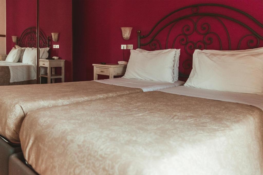 Postel nebo postele na pokoji v ubytování Hotel Benacus