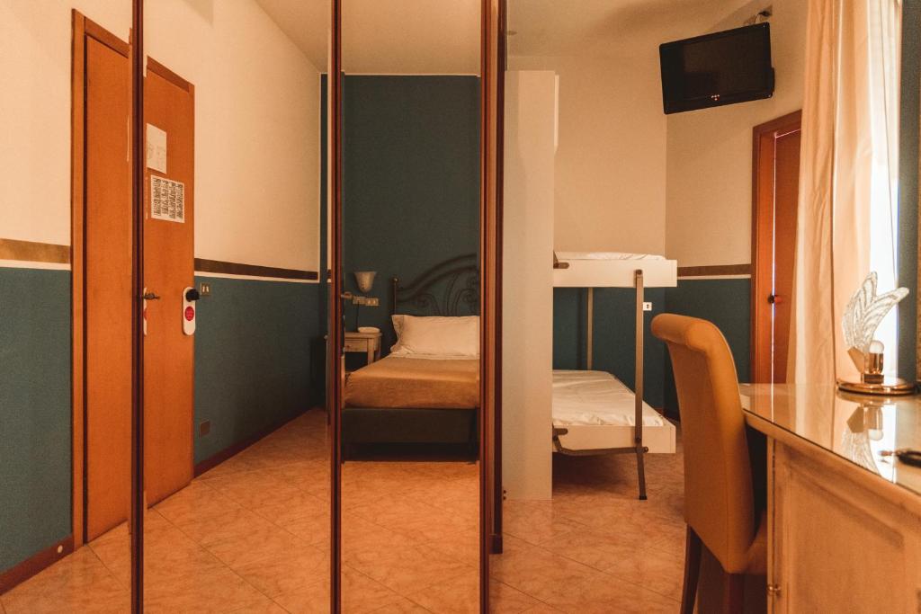Postel nebo postele na pokoji v ubytování Hotel Benacus