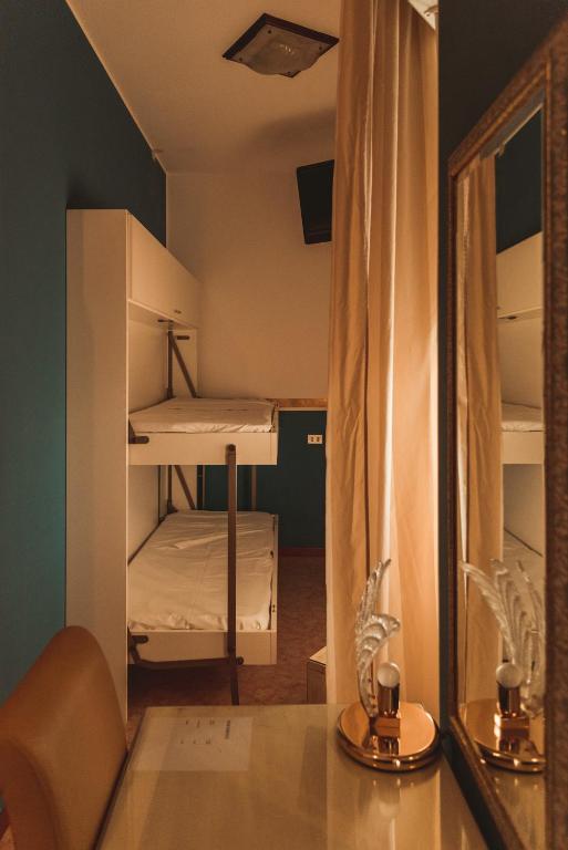 Postel nebo postele na pokoji v ubytování Hotel Benacus