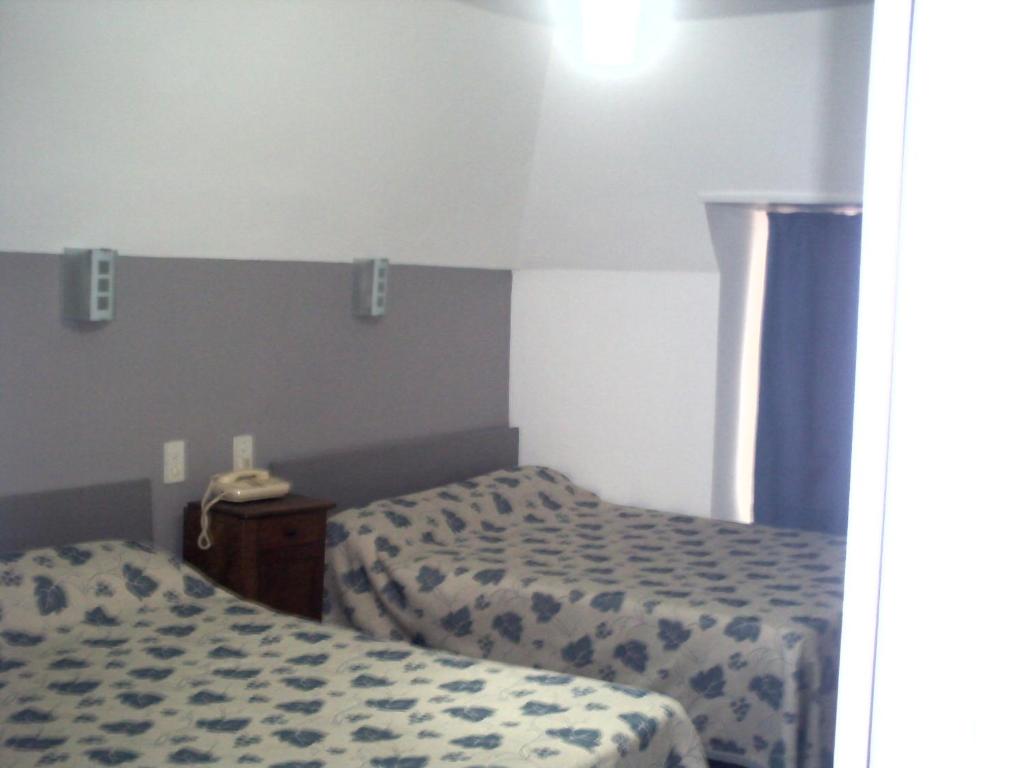 Postel nebo postele na pokoji v ubytování Le Ranfort Chambres d'Hôtes