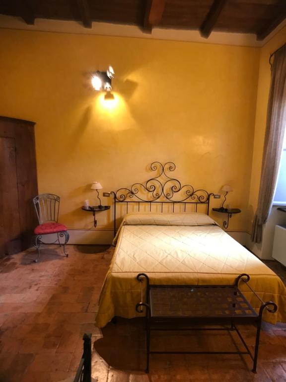 Posteľ alebo postele v izbe v ubytovaní camere della vecchia posta