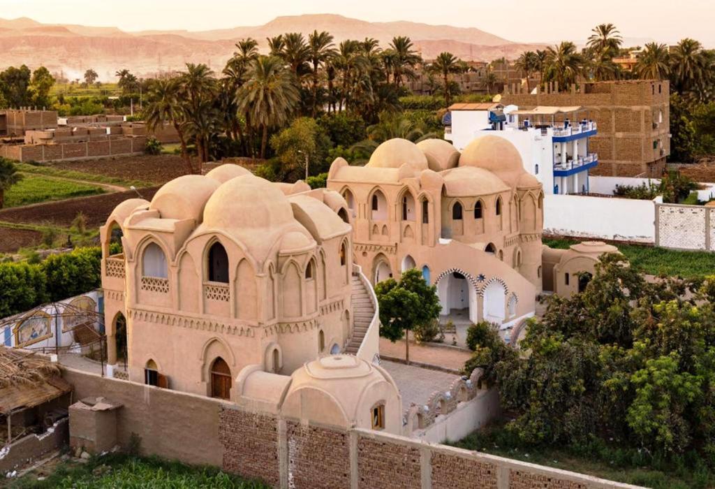 an old building in the middle of a city at Leyla Eco Resort Queen Suites in Luxor