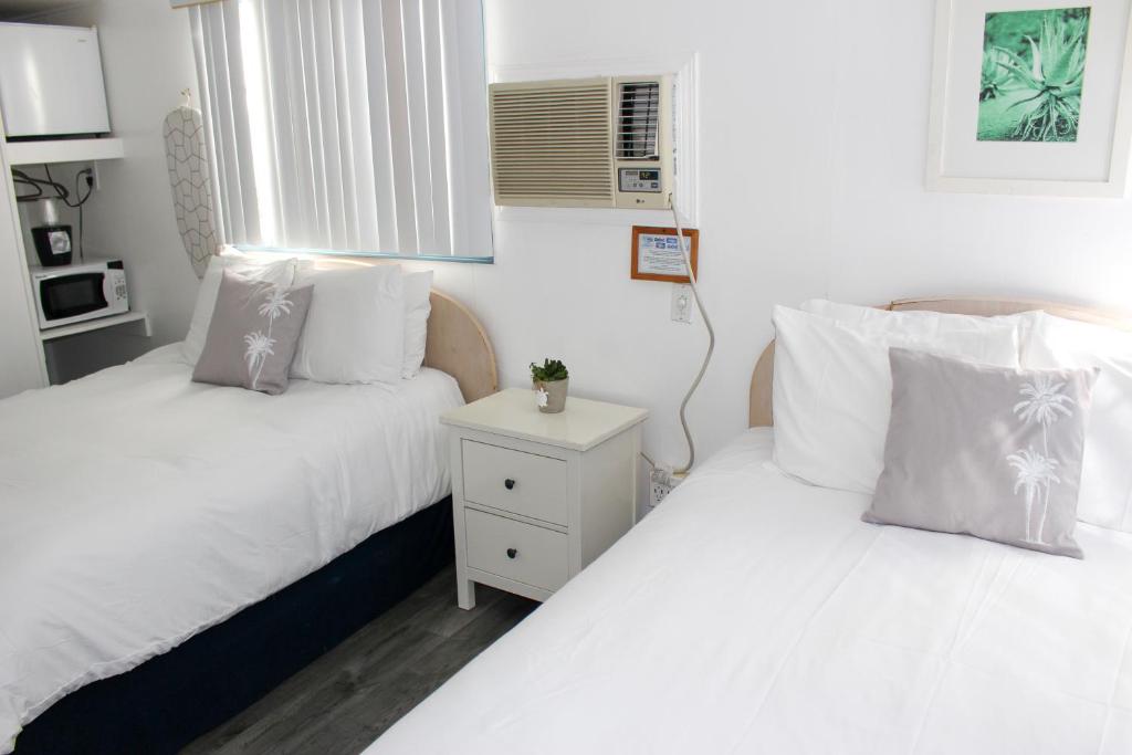 Postel nebo postele na pokoji v ubytování Hermosa Hotel