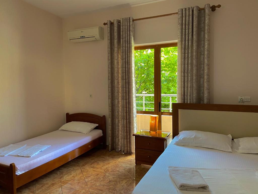 Postel nebo postele na pokoji v ubytování Hotel Metali
