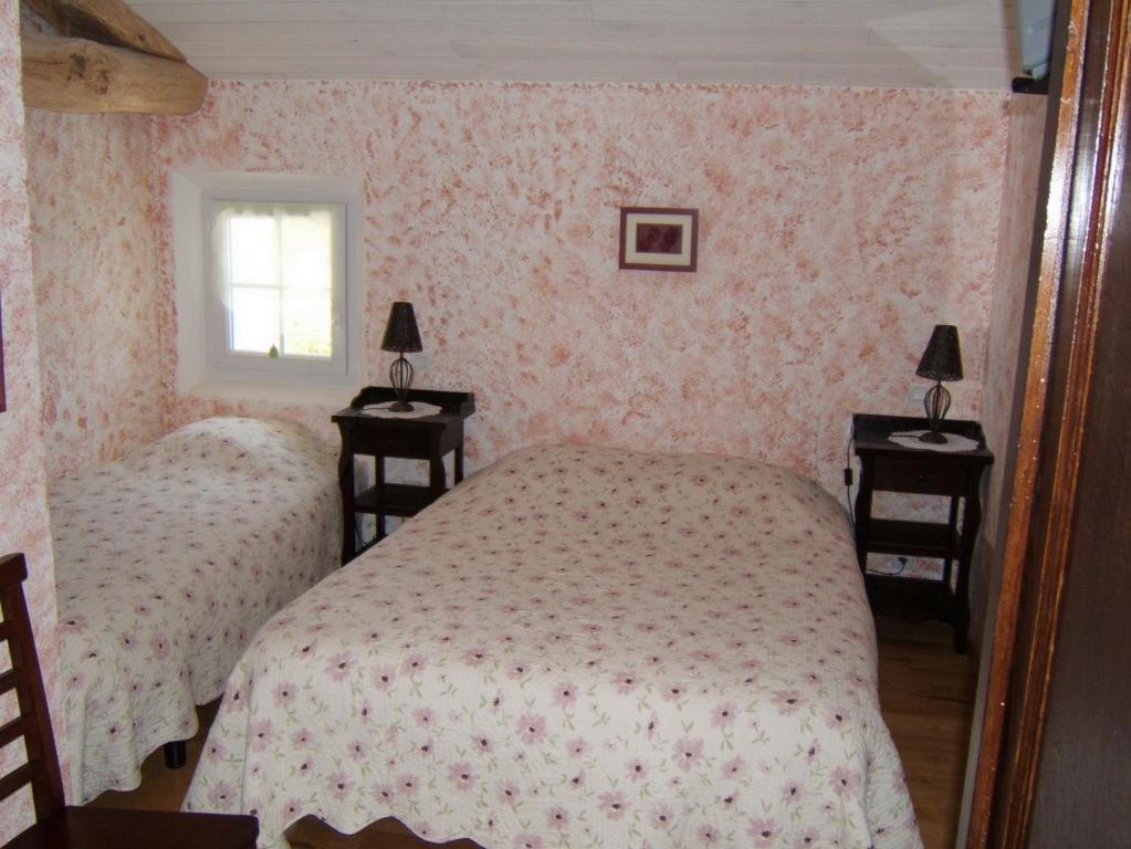 Postel nebo postele na pokoji v ubytování Chambres d'Hôtes Domaine d'En Baleux