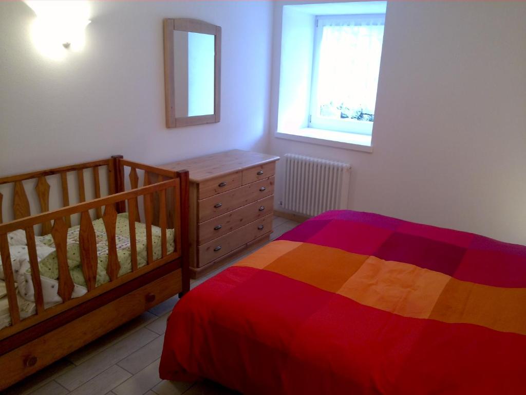 Postel nebo postele na pokoji v ubytování Casa Pergher