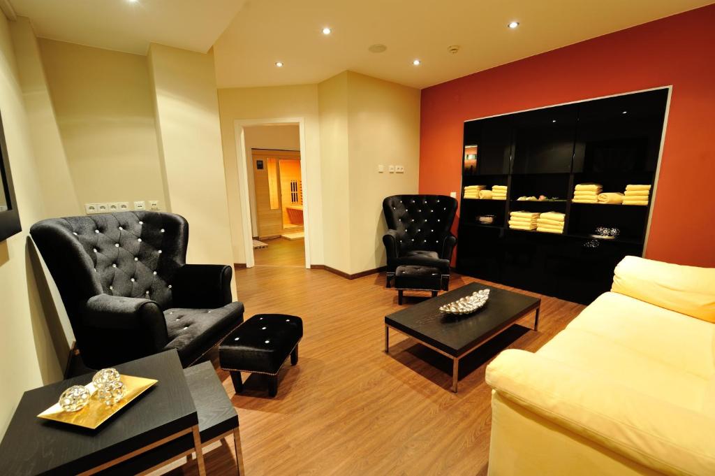 TV a/nebo společenská místnost v ubytování Hotel Vis à vis