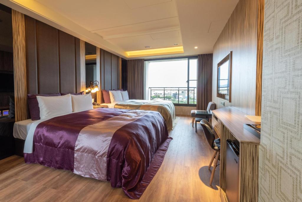 Postel nebo postele na pokoji v ubytování 覓玥精品時尚旅館 Mi Yue Boutique Motel