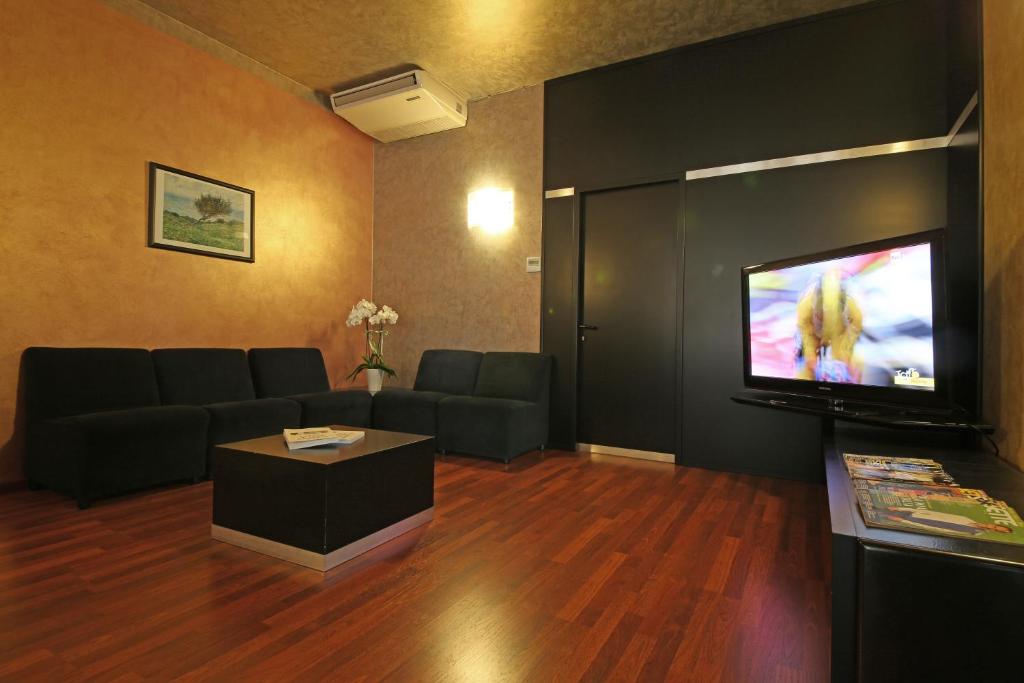 TV a/nebo společenská místnost v ubytování Hotel Residence Ducale
