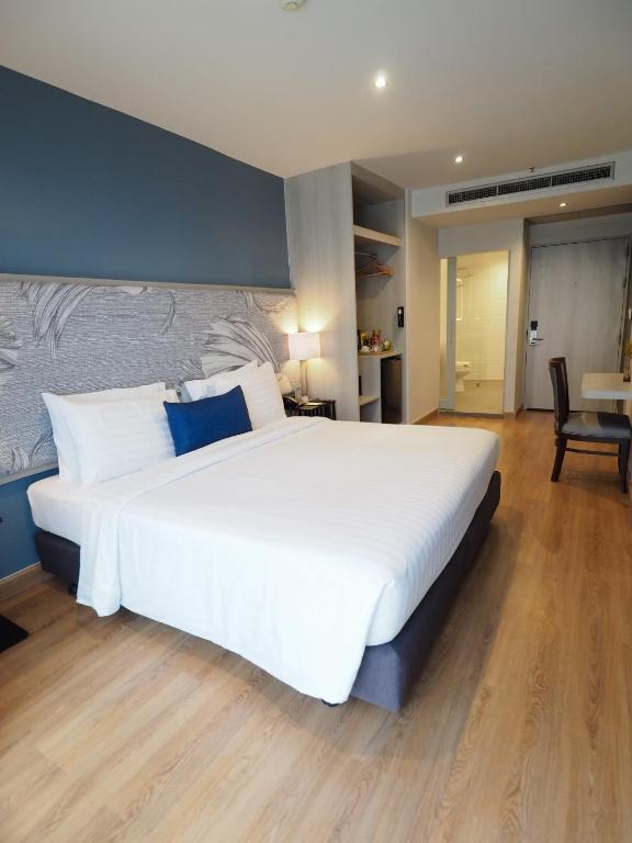 เตียงในห้องที่ Evergreen Place Siam by UHG