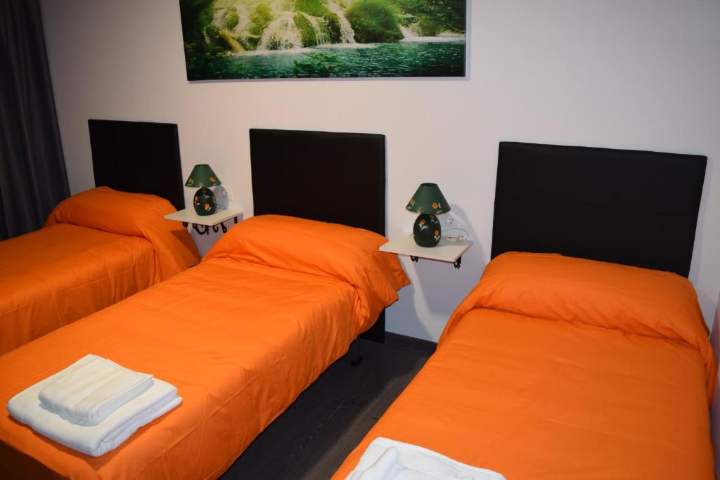 Postel nebo postele na pokoji v ubytování Pensión Tasaga