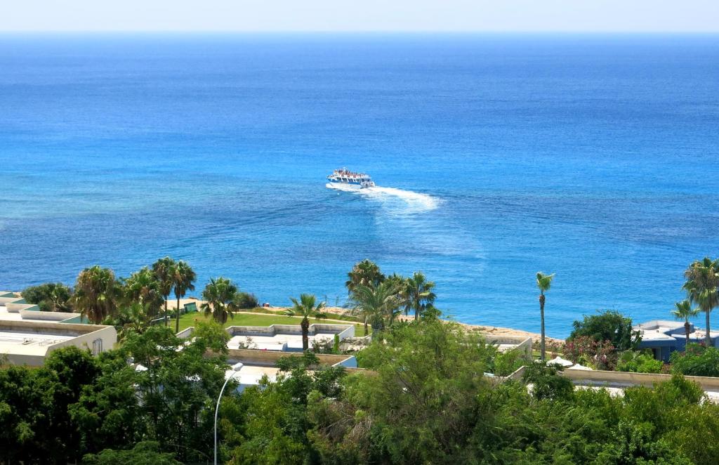 a boat in the water in the ocean at Marina Hotel in Ayia Napa