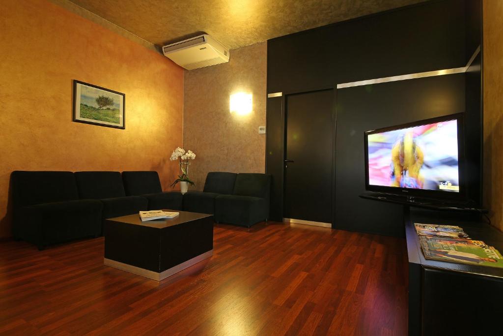 TV a/nebo společenská místnost v ubytování Hotel Residence Ducale