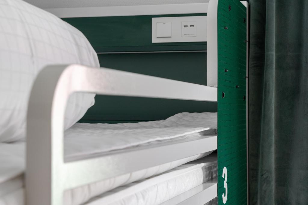 Postel nebo postele na pokoji v ubytování Botanika Uppsala