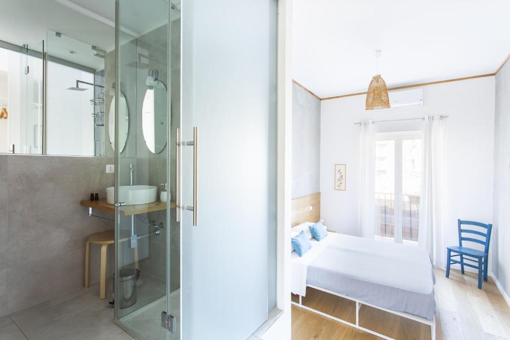 Postel nebo postele na pokoji v ubytování Canceddi Rooms