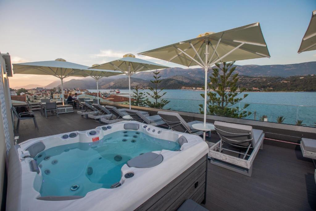 a jacuzzi tub on the deck of a resort at Mouikis Hotel Kefalonia in Argostoli
