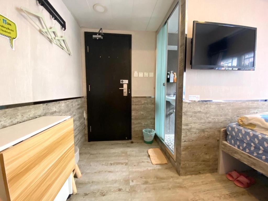 Televízia a/alebo spoločenská miestnosť v ubytovaní Hong Kong Hostel (Tsim Sha Tsui Mansion)