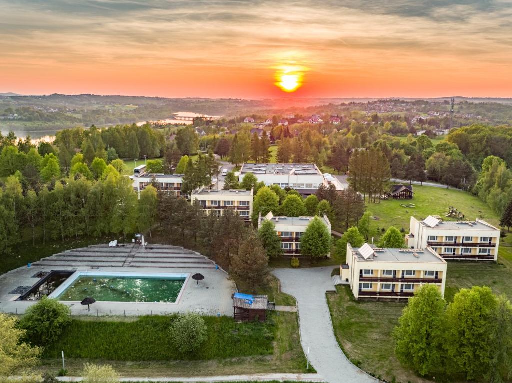 an aerial view of a building with a pool at Hotel Dobczyce in Dobczyce