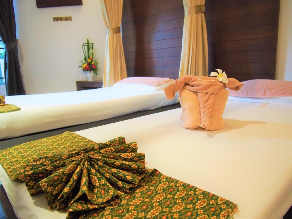 Postel nebo postele na pokoji v ubytování Belle Villa Resort, Chiang Mai