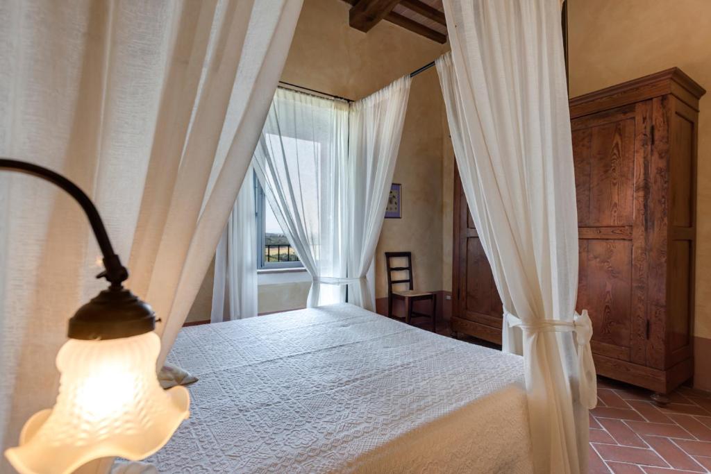 Postel nebo postele na pokoji v ubytování Il Borghetto Tuscan Holidays