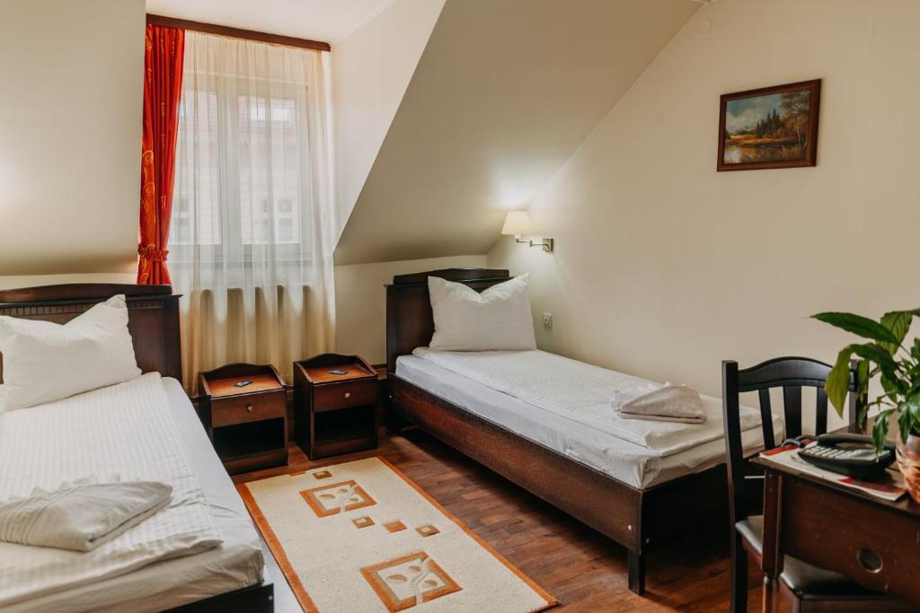 Postel nebo postele na pokoji v ubytování Páva City